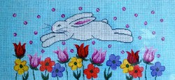 White Bunny Jumping in Garden