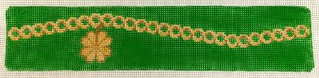 Gold Shamrock Charm on Green Bracelet