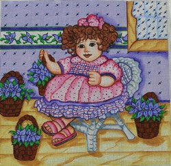 Doll Sitting in a Chair